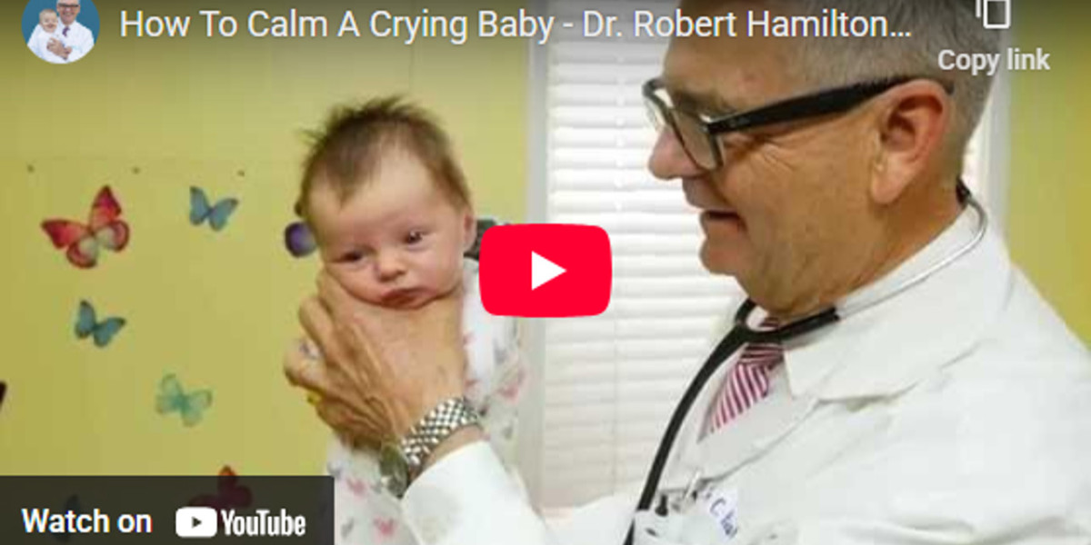 How To Calm A Crying Baby - Dr. Robert Hamilton Demonstrates "The Hold" (Official)